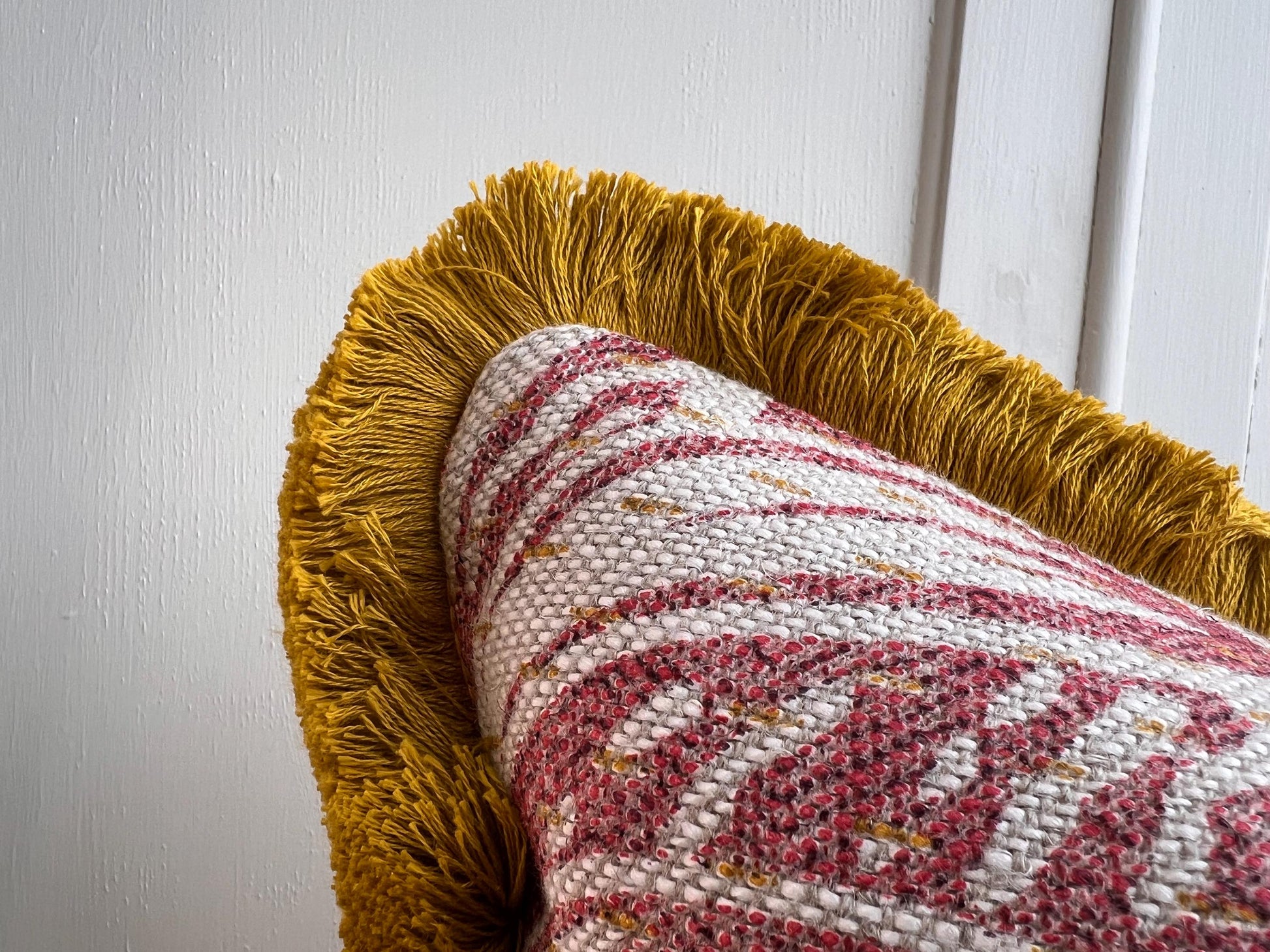 Cushions made in Fermoie Savernake Linen Cushion Cover Burgundy Red Designer Pillow With Mustard Brush Fringe.